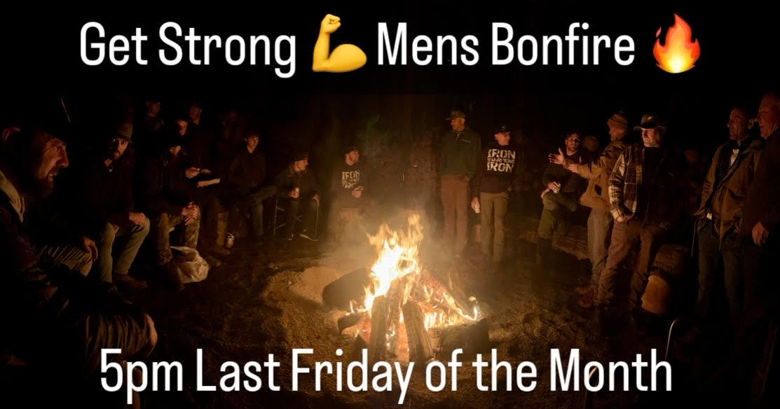 event picture, men gathered around a bonfire